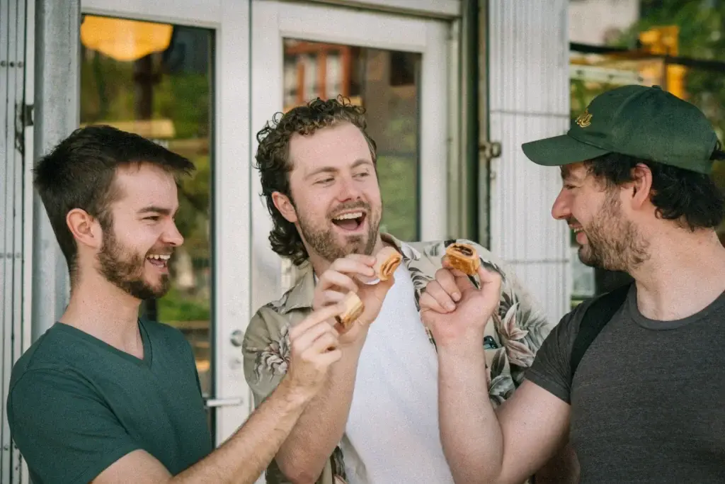 Nice Guy Tours guests tasting food outside a Lower East Side shop