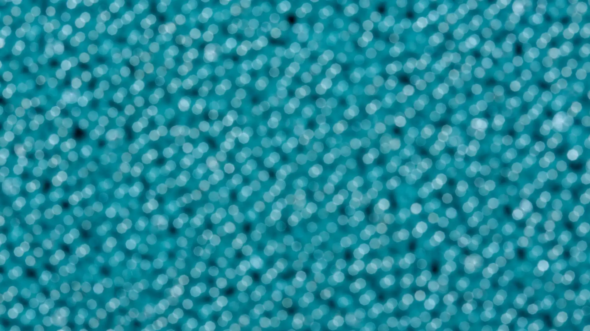 Close-up of tightly packed teal beads
